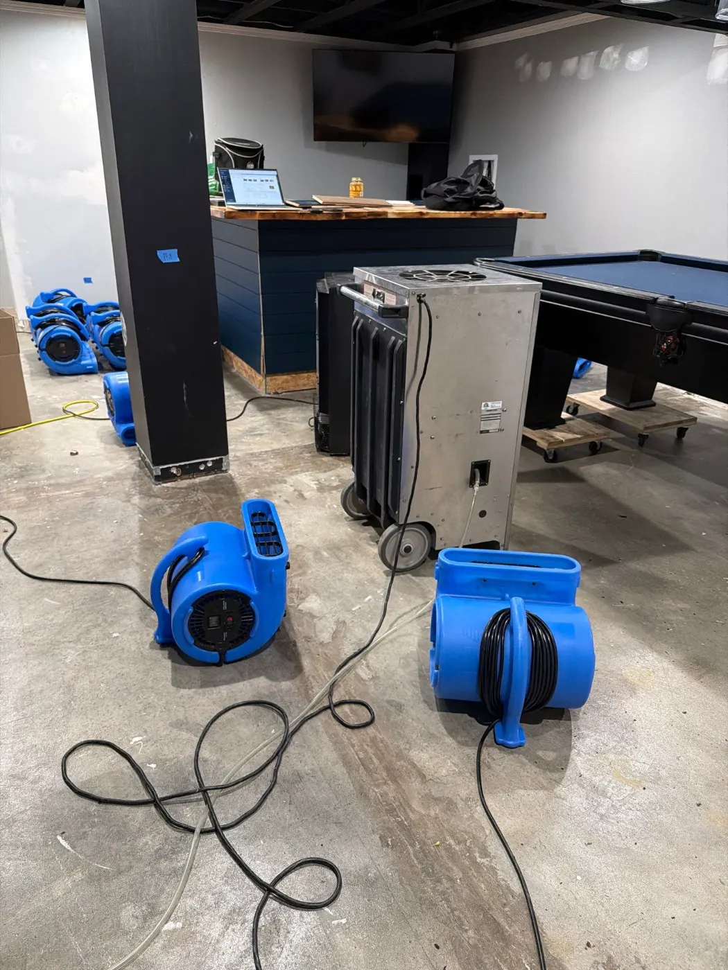 Drying setup in Asherwood finished basement after water event